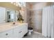 Bright bathroom features a walk-in shower with tile surround, and a modern vanity at 394 Tall Oak Trl, Tarpon Springs, FL 34688