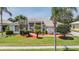Well maintained single story home showcasing manicured landscaping and inviting front entrance at 394 Tall Oak Trl, Tarpon Springs, FL 34688