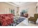 Bright living room filled with natural light, featuring a large window and comfortable seating at 394 Tall Oak Trl, Tarpon Springs, FL 34688