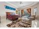 Spacious main bedroom with a view of the pool and a plush rug at 394 Tall Oak Trl, Tarpon Springs, FL 34688
