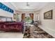 Bright main bedroom with tiled floor, tray ceiling, and access to a pool view at 394 Tall Oak Trl, Tarpon Springs, FL 34688