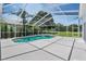Private screened-in pool surrounded by lush greenery, perfect for relaxing and enjoying the outdoors at 394 Tall Oak Trl, Tarpon Springs, FL 34688