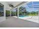 Screened-in pool area perfect for outdoor living and entertaining with lush landscaping at 394 Tall Oak Trl, Tarpon Springs, FL 34688