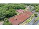 Aerial view of multiple tennis courts at the community's recreational facilities at 394 Tall Oak Trl, Tarpon Springs, FL 34688