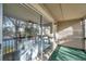 Enclosed porch offering water views and outdoor seating at 6311 Newtown Cir # 11B1, Tampa, FL 33615