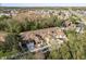 A stunning aerial view of townhomes surrounded by lush landscaping and mature trees in a vibrant community at 8907 Casablanca Way, Tampa, FL 33626