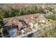 Aerial view of a well-maintained community featuring attached garages and mature trees at 8907 Casablanca Way, Tampa, FL 33626