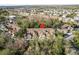 An aerial view highlights the property's location within a well-developed residential community surrounded by trees at 8907 Casablanca Way, Tampa, FL 33626