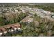 Townhomes in a mixed-use community with retail and residential areas, surrounded by mature trees and lush landscaping at 8907 Casablanca Way, Tampa, FL 33626