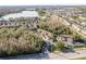 Stunning aerial view of townhomes in a community near a lake, highlighting its serene location and neighborhood layout at 8907 Casablanca Way, Tampa, FL 33626