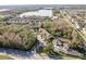 Aerial view of townhomes within a vibrant community, set near a picturesque lake and lush surroundings at 8907 Casablanca Way, Tampa, FL 33626