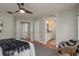 Primary bedroom showcasing bathroom access, wood floors, and spacious layout at 8907 Casablanca Way, Tampa, FL 33626