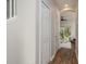Bright hallway with wood floors leading to a cozy living area and backyard at 8907 Casablanca Way, Tampa, FL 33626