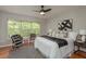 Cozy main bedroom featuring a large window and stylish black-and-white accents at 8907 Casablanca Way, Tampa, FL 33626