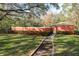 Path leading to a community pool area surrounded by lush landscaping at 8907 Casablanca Way, Tampa, FL 33626