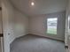 Bedroom with carpet and a bright window at 13290 Ogden Glade Rd, Dade City, FL 33525