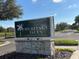 Entrance sign to Heritage Isles Golf & Country Club, set on a stone pillar at 18116 Portside St, Tampa, FL 33647