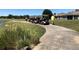 Line of golf carts on a paved path near the golf course, lush greenery around at 18116 Portside St, Tampa, FL 33647