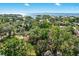Aerial view of community with water view and plenty of mature tree coverage at 4822 W San Miguel St, Tampa, FL 33629