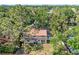 Aerial view of home featuring a backyard, deck, landscaping, and a wooden fence at 4822 W San Miguel St, Tampa, FL 33629