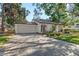 Charming single-story home with a two-car garage and an inviting brick paved driveway at 4822 W San Miguel St, Tampa, FL 33629