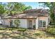 Charming single-story home with a well-manicured lawn and beautiful landscaping at 4822 W San Miguel St, Tampa, FL 33629