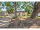 Inviting single-Gathering home featuring mature trees and lush landscaping at 4822 W San Miguel St, Tampa, FL 33629