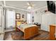 Cozy bedroom featuring stylish wood floors, fun decor, and bright windows at 6020 Kestrel Point Ave, Lithia, FL 33547