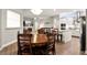 Open concept dining room features hardwood floors and modern lighting at 6020 Kestrel Point Ave, Lithia, FL 33547