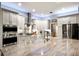 Modern kitchen boasting custom cabinets, stainless steel appliances, and a large center island with a breakfast bar at 6020 Kestrel Point Ave, Lithia, FL 33547