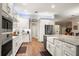Bright kitchen features stainless steel appliances, granite countertops, and white cabinets at 6020 Kestrel Point Ave, Lithia, FL 33547