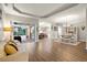 Bright and open living space with hardwood floors, tray ceiling and seamless access to the outdoor pool area at 6020 Kestrel Point Ave, Lithia, FL 33547