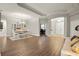 Spacious living area with tray ceiling, hardwood floors, ample natural light, and open concept design at 6020 Kestrel Point Ave, Lithia, FL 33547