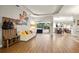 Bright living area with hardwood floors, comfortable seating, and easy access to the pool at 6020 Kestrel Point Ave, Lithia, FL 33547