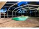 Screened-in pool area showcasing a sparkling pool and spa for outdoor relaxation and entertainment at 6020 Kestrel Point Ave, Lithia, FL 33547
