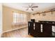 Bedroom featuring wood floors, a ceiling fan, and plenty of natural light at 823 Scenic Heights Dr, Brandon, FL 33511