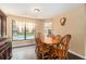 Traditional dining room features a wood table, chairs, and a large window overlooking the pool at 823 Scenic Heights Dr, Brandon, FL 33511