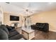 Spacious living room features hardwood floors, ceiling fan, and access to the backyard at 823 Scenic Heights Dr, Brandon, FL 33511