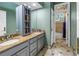 Double sink bathroom featuring granite countertops and natural lighting at 8755 Commodore Dr, Seminole, FL 33776
