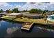 Waterfront house with a private boat dock, offering direct access to the water and scenic views at 9439 Sun Isle Ne Dr, St Petersburg, FL 33702