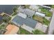 Aerial view of home showcasing roof, yard, driveway, and proximity to waterfront at 1022 Canal St, Ruskin, FL 33570