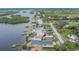 Waterfront home with private dock, lush greenery, and serene canal views at 1022 Canal St, Ruskin, FL 33570