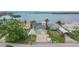 Street view of a charming home featuring lush landscaping, and a spacious driveway at 1022 Canal St, Ruskin, FL 33570