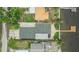 Birds-eye view of home with dark roof, well-kept landscaping, and waterfront access at 1022 Canal St, Ruskin, FL 33570