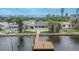 Relaxing backyard featuring a private wooden dock, perfect for enjoying waterfront views at 1022 Canal St, Ruskin, FL 33570