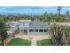 Beautiful home boasts a large outdoor patio, a charming balcony, and lovely backyard space at 1022 Canal St, Ruskin, FL 33570