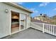 Private balcony overlooking lush foliage offering serene outdoor retreat space and bedroom access at 1022 Canal St, Ruskin, FL 33570