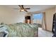 Serene bedroom with large window overlooking the bay and a cozy bed at 1022 Canal St, Ruskin, FL 33570