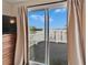 Sliding glass door providing access to a private balcony with stunning water views at 1022 Canal St, Ruskin, FL 33570