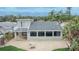 Rear exterior displaying a patio and lush landscaping at 1022 Canal St, Ruskin, FL 33570